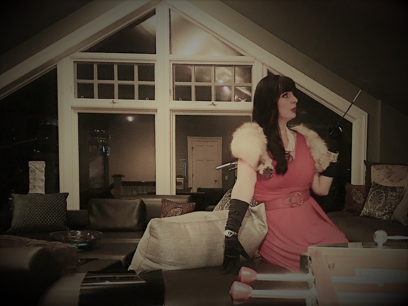Clue: Murder is not a Game - Miss Starlett relaxing in the games room with the cigarette holder